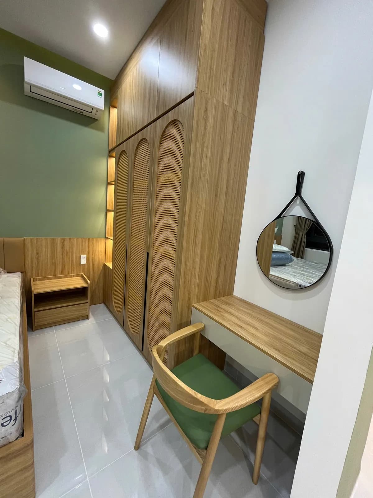 Studio apartments — green accents & arched details — 2