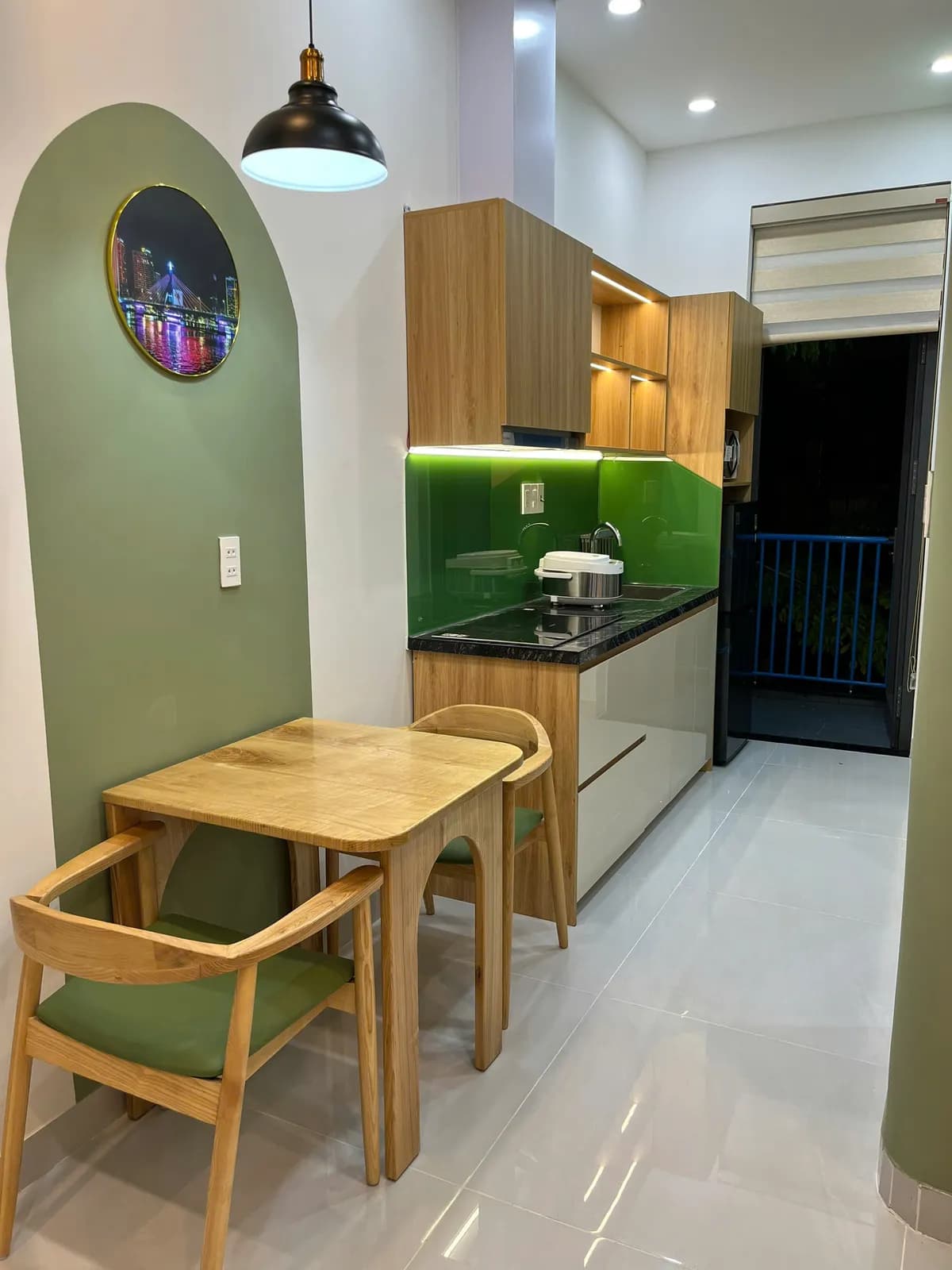 Studio apartments — green accents & arched details — 3