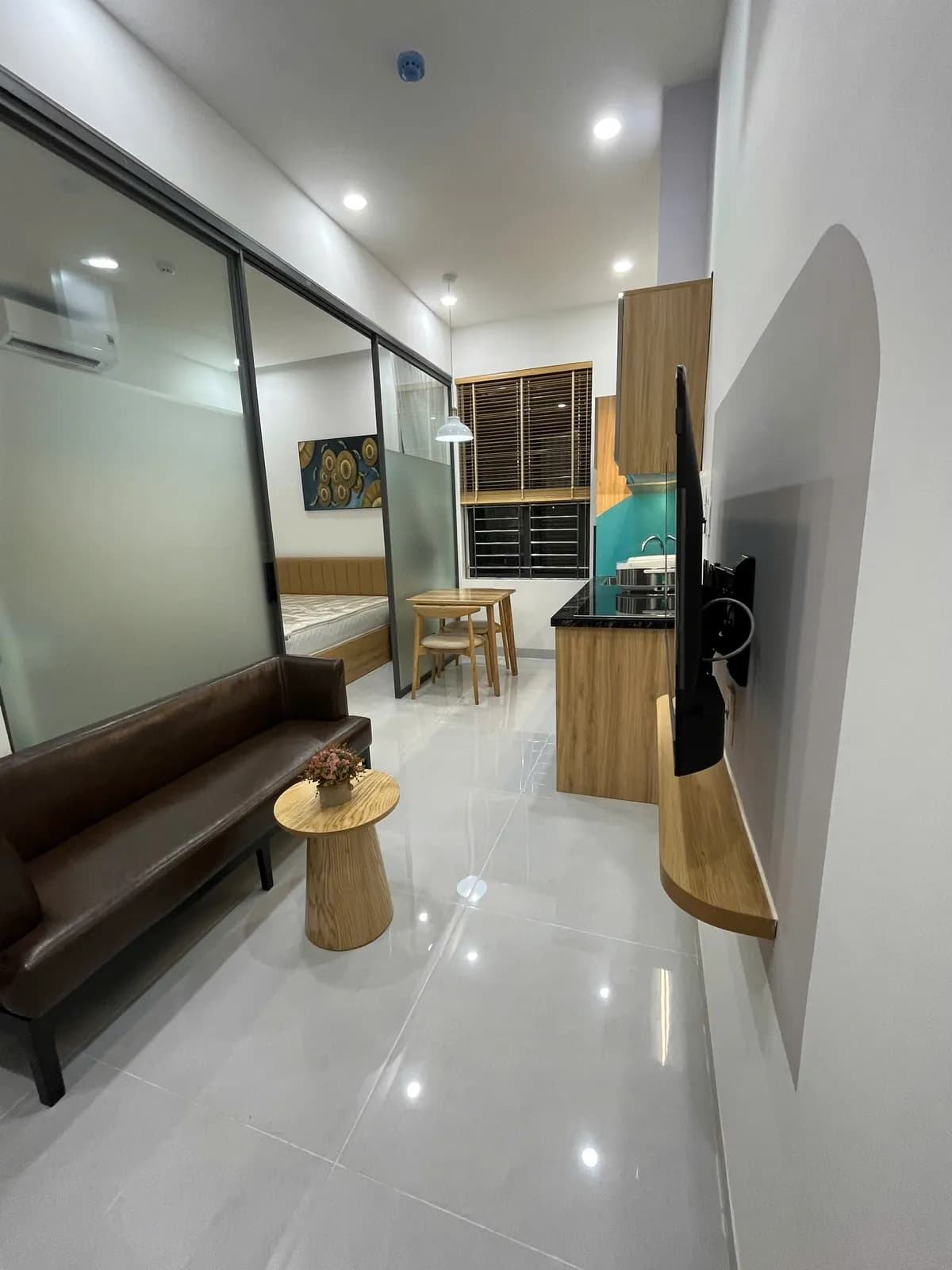 Studio apartments — green accents & arched details — 5