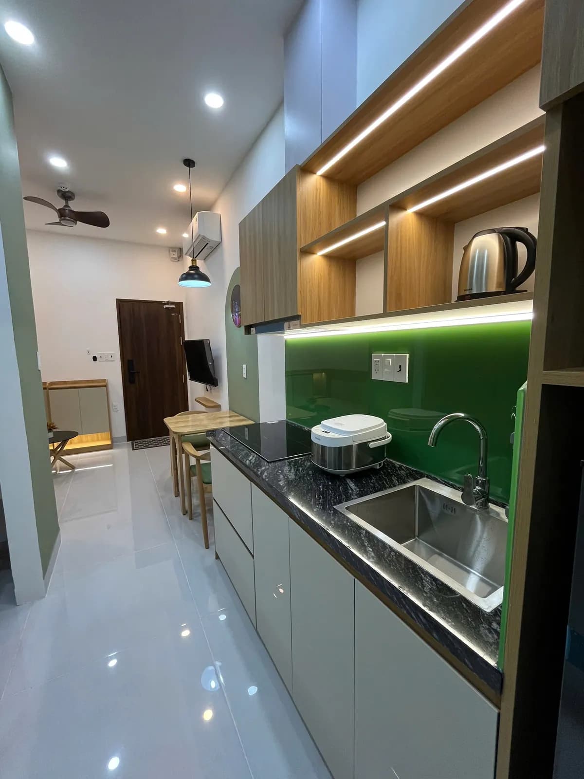Studio apartments — green accents & arched details — 8
